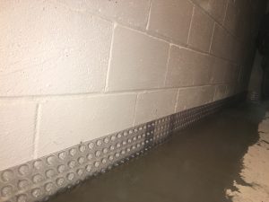 Sealing basement foundation with concrete