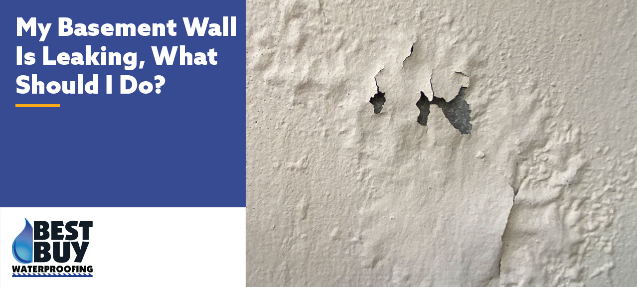 Basement wall with peeling paint and moisture damage caused by a water leak.