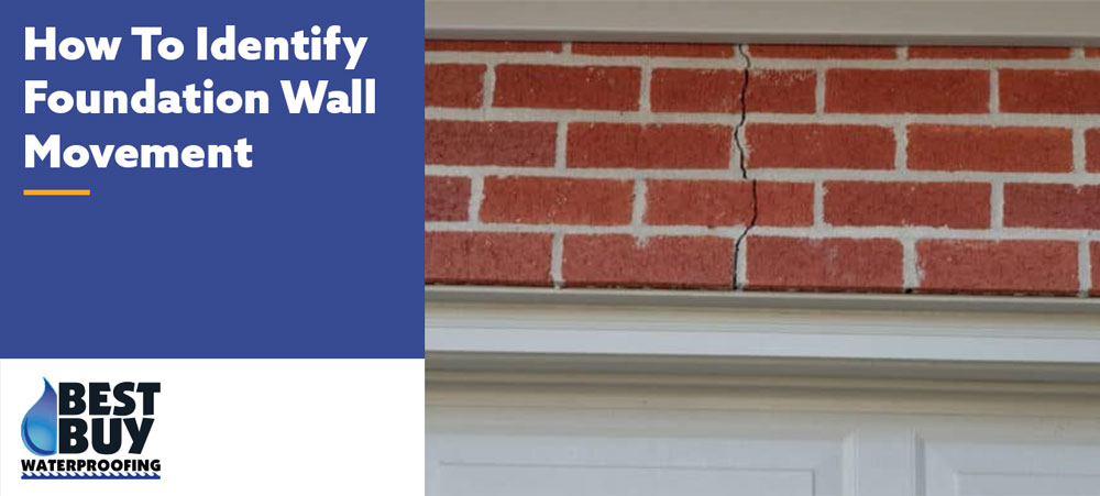 Vertical crack in a brick foundation wall above a residential garage, showing a common sign of foundation wall movement.