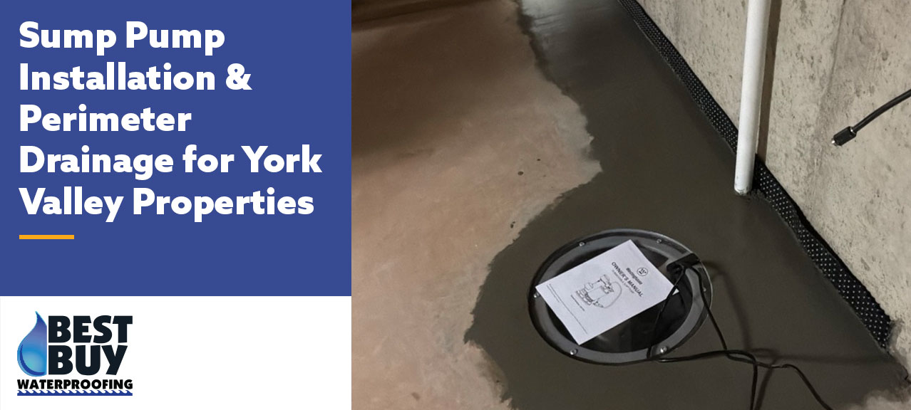 Newly installed sump pump basin and perimeter drainage system in a residential basement, featuring a sealed sump pit, discharge pipe, and drainage channel along the foundation wall.